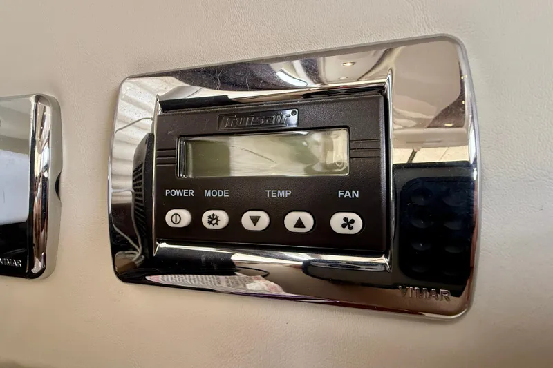 Slide: The Image of Digital control panel on a 2014 Meridian 391 Sedan yacht, featuring power, mode, temp, and fan settings. - 20