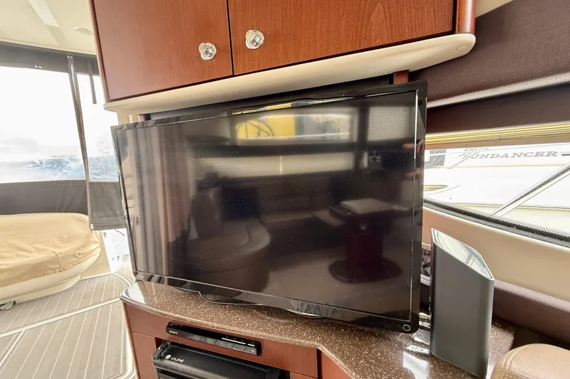 Slide: The Image of Interior of 2014 Meridian 391 Sedan with TV and wooden cabinetry. - 25