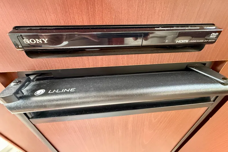 Slide: The Image of Sony DVD player and U-Line appliance in 2014 Meridian 391 Sedan interior. - 26