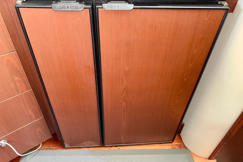 Slide: The Image of Wood-paneled Nova Kool refrigerator in 2014 Meridian 391 Sedan yacht interior. - 31