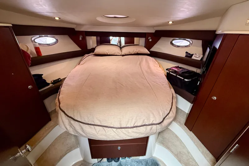 Slide: The Image of Luxurious cabin interior of 2014 Meridian 391 Sedan yacht with cozy bed and elegant wood finish. - 32