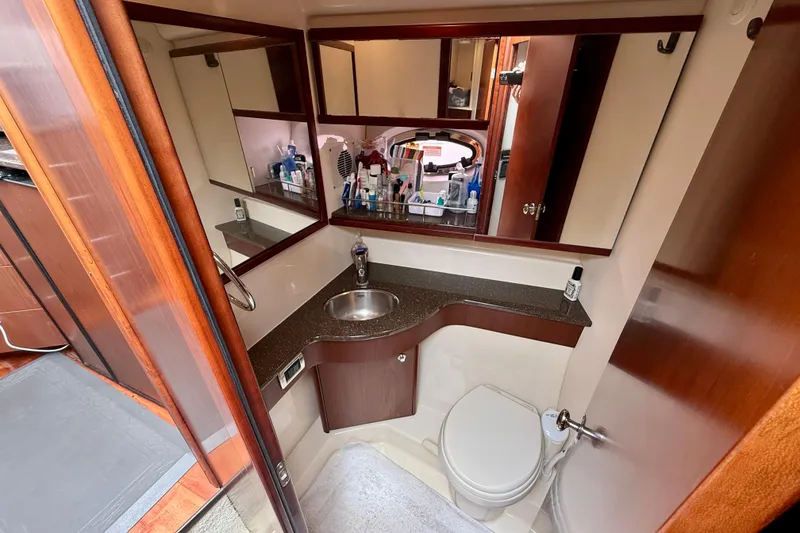 Slide: The Image of Luxurious bathroom in 2014 Meridian 391 Sedan yacht with modern fixtures and ample storage. - 35