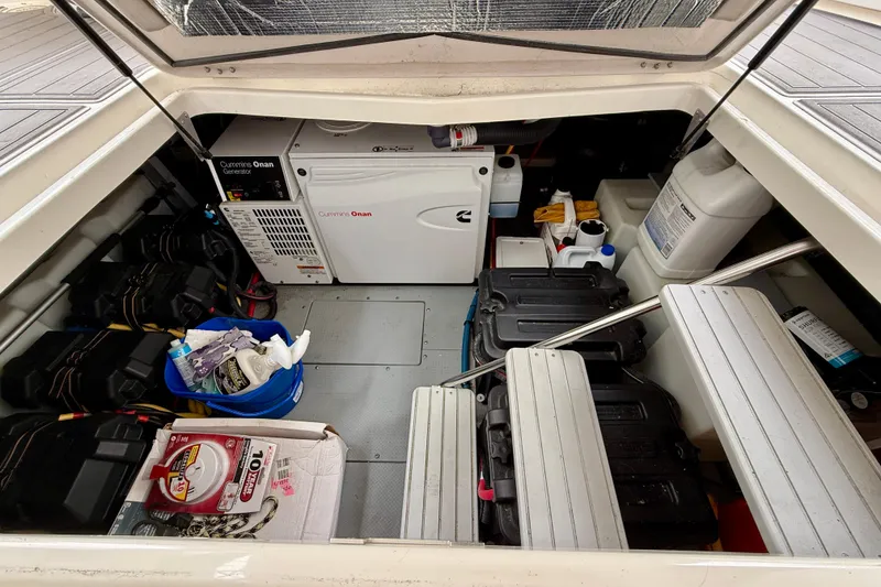 Slide: The Image of Engine compartment of 2014 Meridian 391 Sedan with Cummins Onan generator and storage items. - 38
