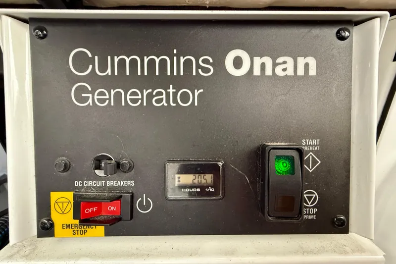 Slide: The Image of Cummins Onan generator control panel on 2014 Meridian 391 Sedan boat. - 39