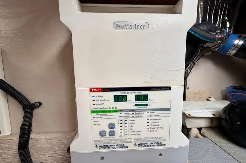 Slide: The Image of ProMariner battery charger in a 2014 Meridian 391 Sedan, displaying voltage and amperage readings. - 41