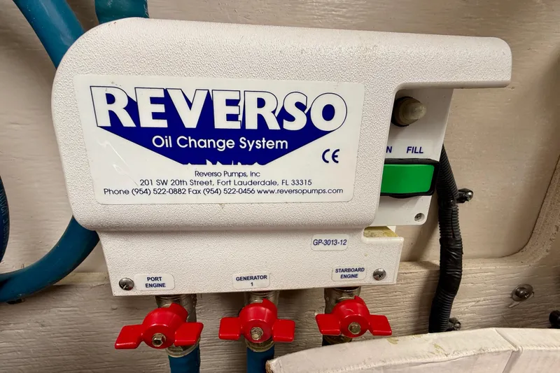 Slide: The Image of Reverso oil change system on 2014 Meridian 391 Sedan boat, featuring control valves. - 42