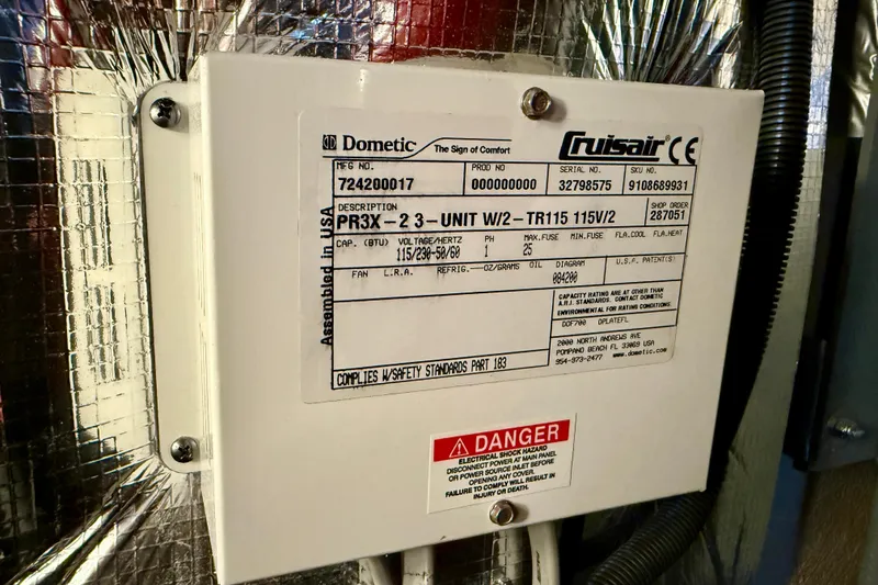 Slide: The Image of Electrical control box on a 2014 Meridian 391 Sedan, featuring Dometic Cruisair specifications. - 44