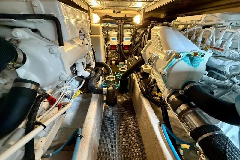 Slide: The Image of Engine room of 2014 Meridian 391 Sedan yacht, showcasing dual engines and mechanical components. - 46