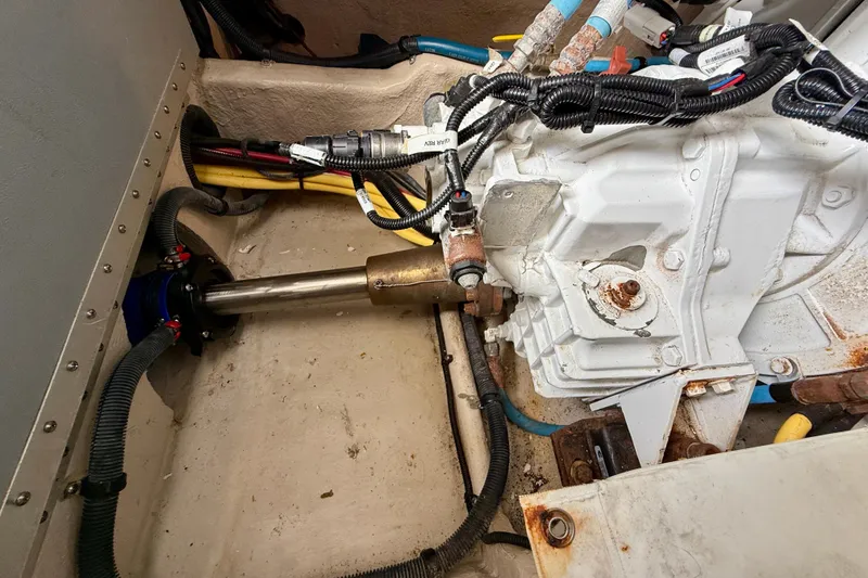 Slide: The Image of Engine compartment of a 2014 Meridian 391 Sedan, showcasing mechanical components and wiring. - 48