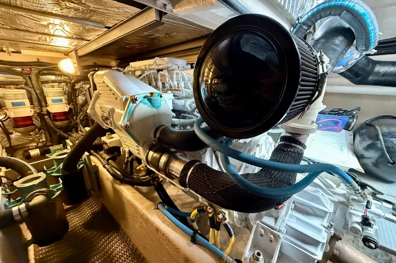 Slide: The Image of Engine room of 2014 Meridian 391 Sedan yacht, showcasing detailed mechanical components. - 49