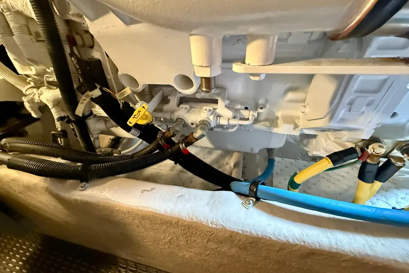 Slide: The Image of Engine compartment of a 2014 Meridian 391 Sedan with visible hoses and connections. - 50