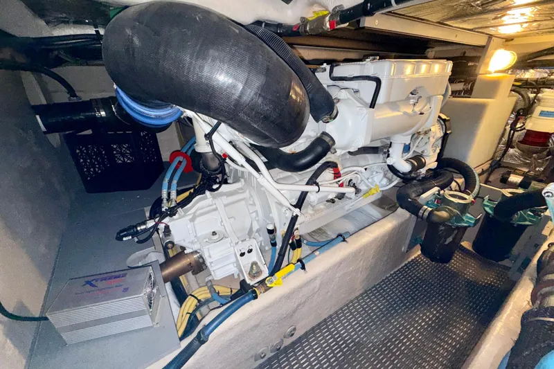 Slide: The Image of Engine room of 2014 Meridian 391 Sedan yacht, showcasing detailed mechanical components. - 51