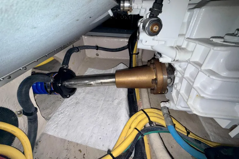 Slide: The Image of Engine compartment of a 2014 Meridian 391 Sedan with visible propeller shaft and wiring. - 52