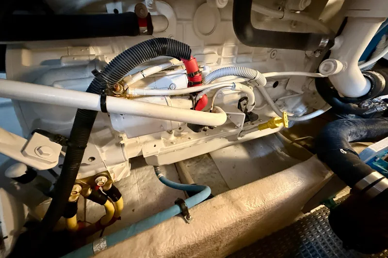 Slide: The Image of Engine room of a 2014 Meridian 391 Sedan, showcasing various hoses and components. - 53