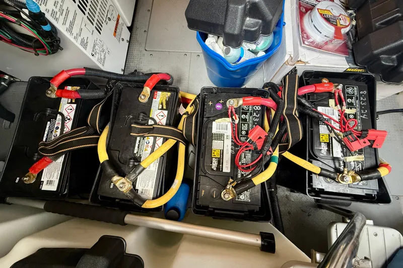 Slide: The Image of Batteries and wiring in a 2014 Meridian 391 Sedan engine compartment. - 57