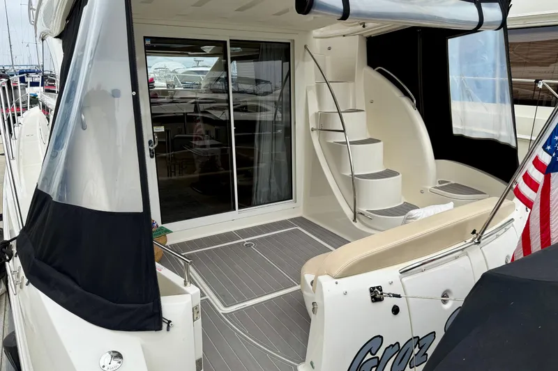 Slide: The Image of 2014 Meridian 391 Sedan yacht with elegant deck and spiral staircase. - 8