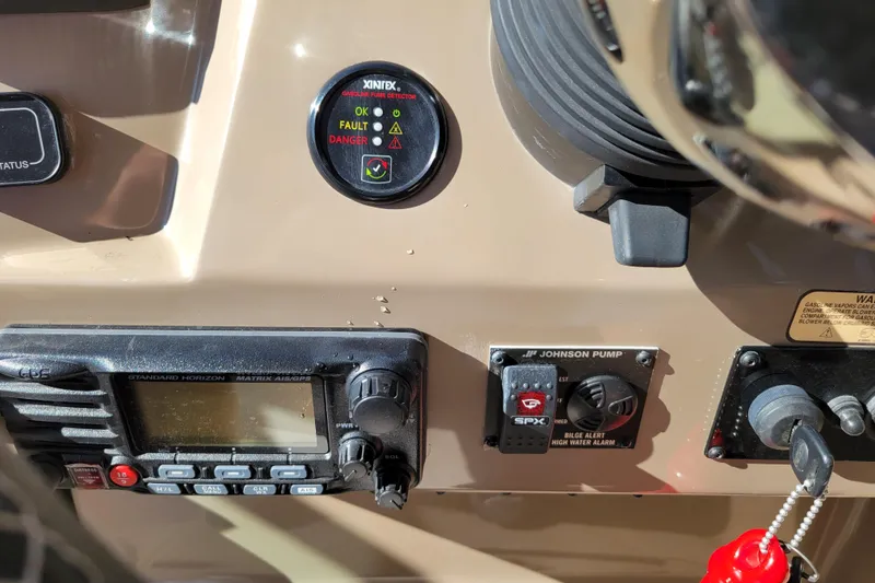 Slide: The Image of Control panel of a 2018 Regal 26 Express boat with various gauges and switches. - 19