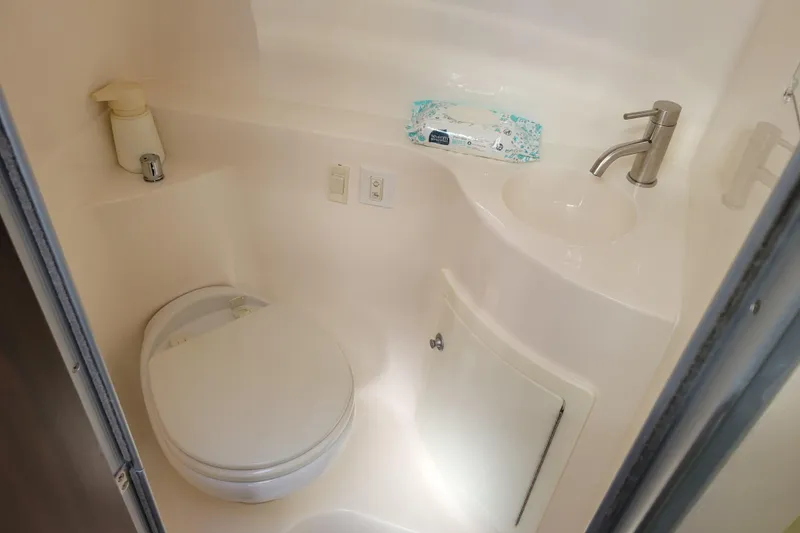 Slide: The Image of Interior of 2018 Regal 26 Express boat with TV and control panel. - 32