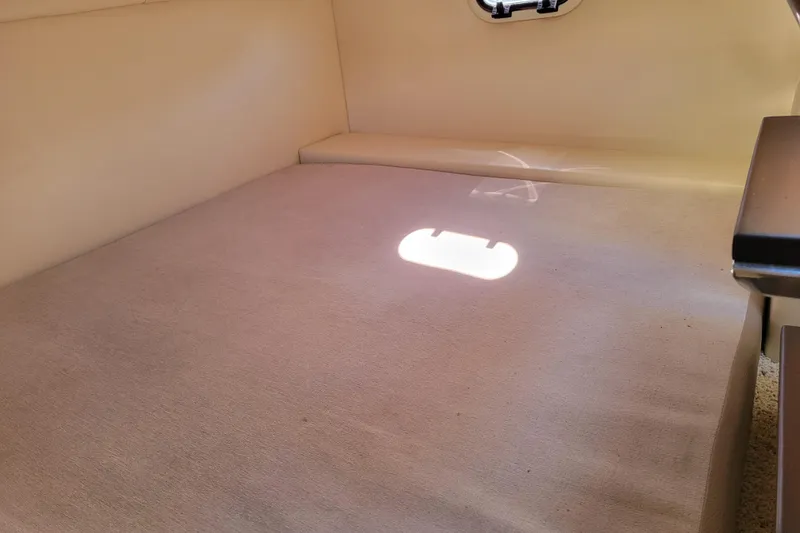 Slide: The Image of Shower area inside 2018 Regal 26 Express boat, featuring chrome fixtures and mirror. - 35