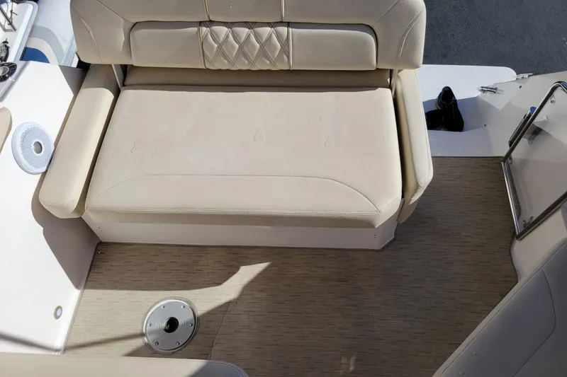 Slide: The Image of Interior cabin of 2018 Regal 26 Express boat with beige upholstery. - 36