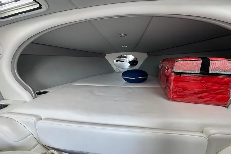 Slide: The Image of Interior cabin of 2005 Formula 292 FASTech boat with cushions and storage. - 12