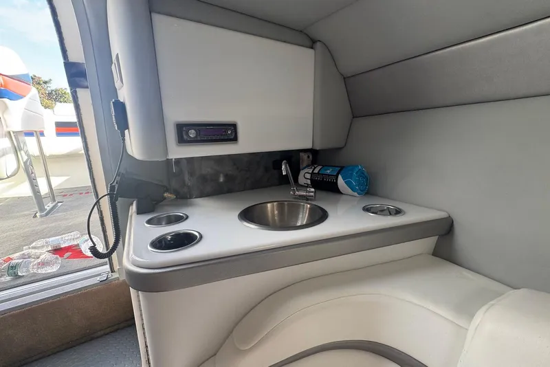 Slide: The Image of 2005 Formula 292 FASTech boat interior with sink and storage area. - 14
