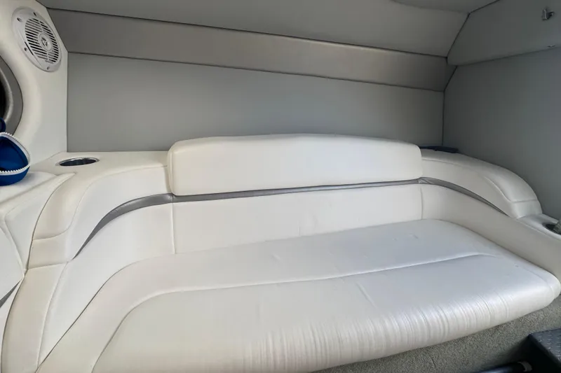 Slide: The Image of 2005 Formula 292 FASTech boat interior with white leather seating and speaker. - 15