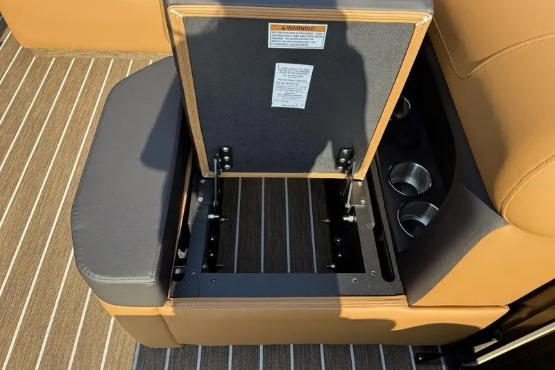 Slide: The Image of Open storage compartment in 2026 Premier 250 Solaris RS CL boat seat. - 22