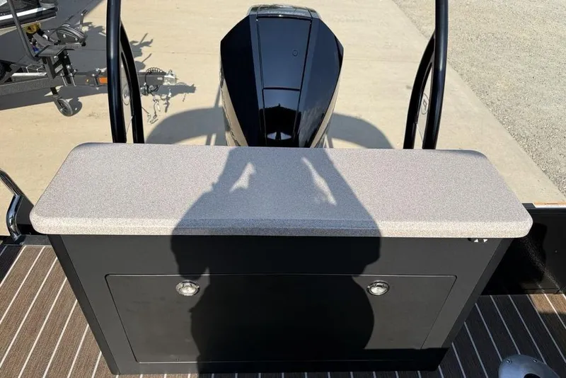 Slide: The Image of 2026 Premier 250 Solaris RS CL boat with sleek black motor and storage compartment. - 42