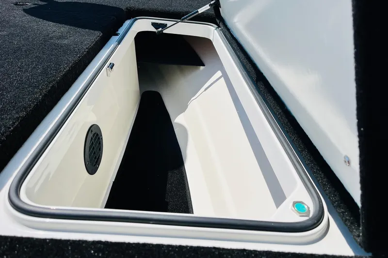 Slide: The Image of Open storage compartment in 2025 Ranger Z520 boat, featuring sleek interior design. - 19