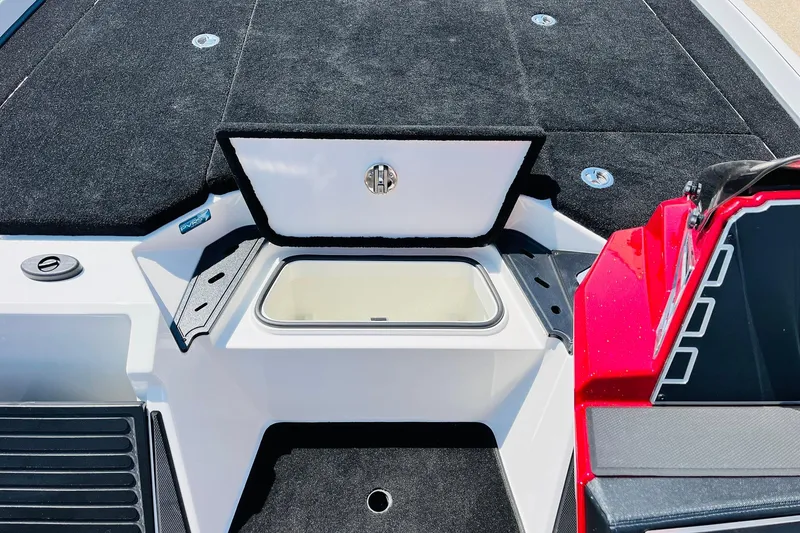 Slide: The Image of 2025 Ranger Z520 boat interior with open storage compartment and sleek design. - 23