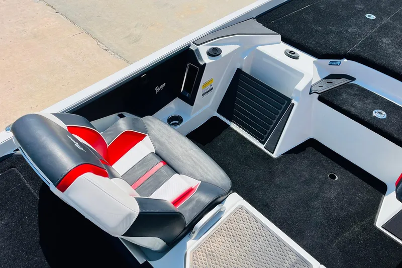 Slide: The Image of 2025 Ranger Z520 boat interior with black and red seating, sleek design. - 30