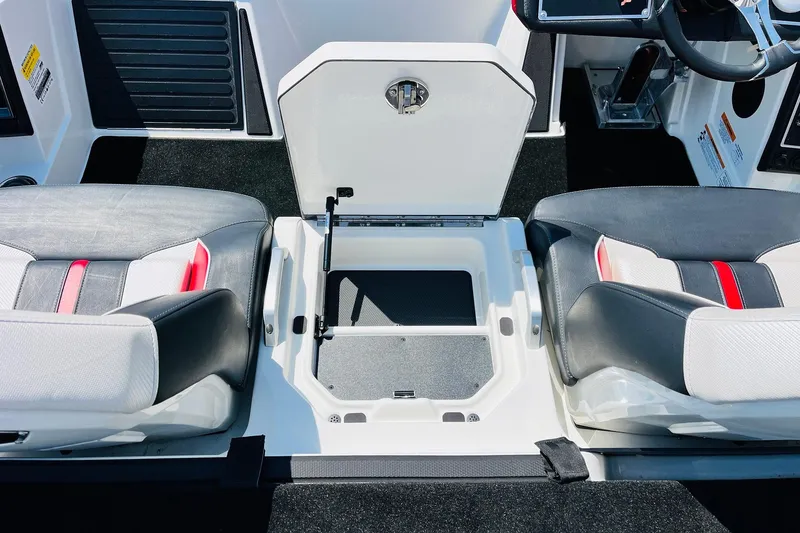 Slide: The Image of 2025 Ranger Z520 boat interior with open storage compartment and stylish seating. - 34