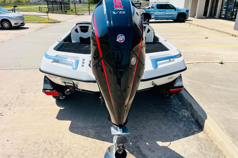 Slide: The Image of 2025 Ranger Z520 boat with powerful V8 engine, parked outdoors at a dealership. - 6