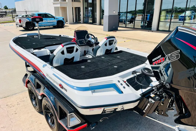 Slide: The Image of 2025 Ranger Z520 boat with Mercury Pro XS engine, parked outside a dealership. - 7