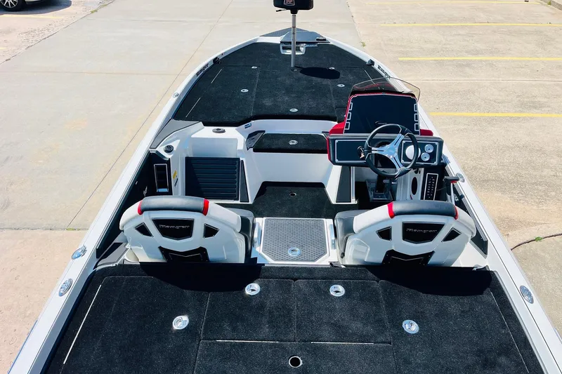 Slide: The Image of 2025 Ranger Z520 boat interior with black seating and modern dashboard. - 9