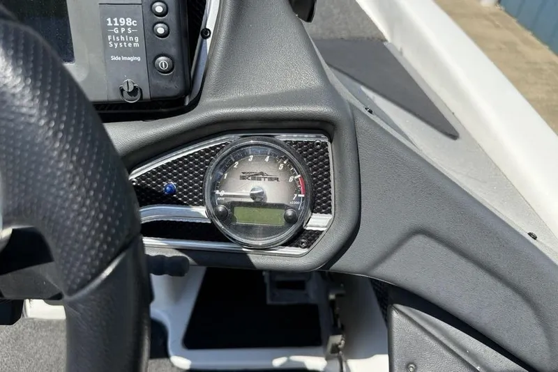 Slide: The Image of 2014 Skeeter FX 20 dashboard with GPS fishing system and speedometer. - 20