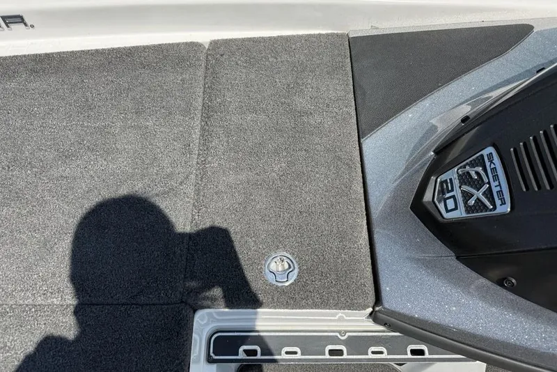 Slide: The Image of 2014 Skeeter FX 20 boat deck with logo and carpeted surface. - 5