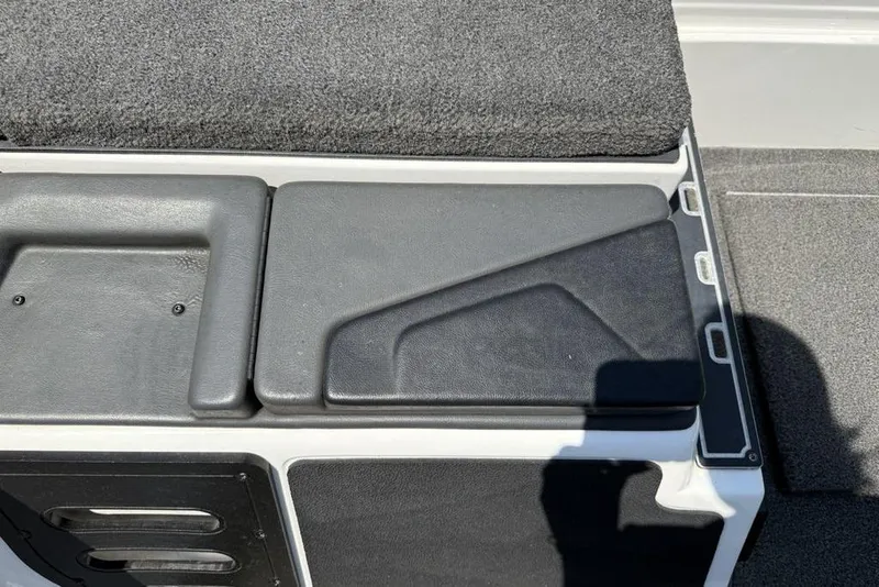 Slide: The Image of 2014 Skeeter FX 20 boat interior with black and gray seating and storage compartments. - 7