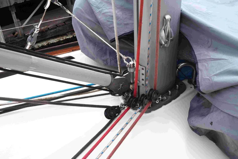 Slide: The Image of Close-up of rigging on a 2004 Dufour 40 Performance sailboat, featuring ropes and pulleys. - 12