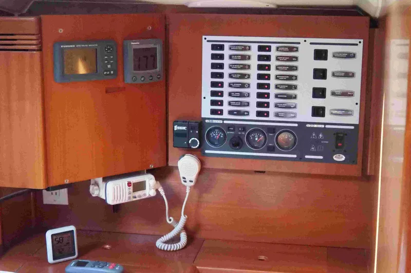 Slide: The Image of Control panel of a 2004 Dufour 40 Performance yacht with navigation instruments. - 22