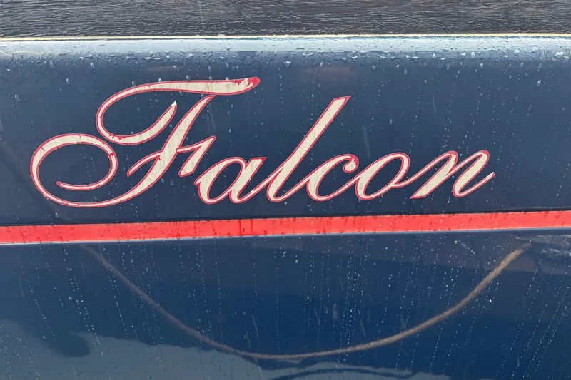 Slide: The Image of Blue Dufour 40 Performance 2004 yacht with "Falcon" name in elegant script. - 41