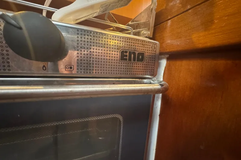 Slide: The Image of Stainless steel oven on 2004 Dufour 40 Performance yacht, featuring ENO branding. - 42