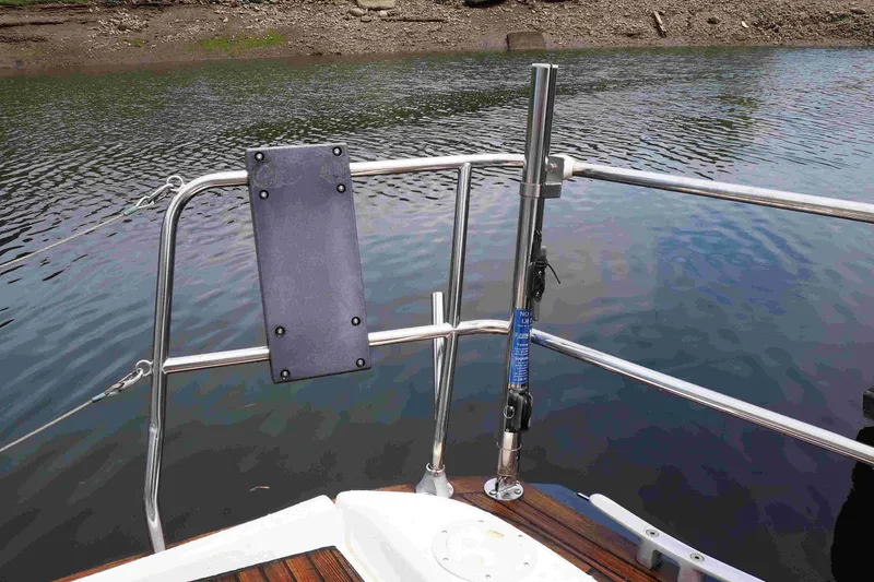 Slide: The Image of Stern view of 2004 Dufour 40 Performance sailboat with stainless steel railings. - 9