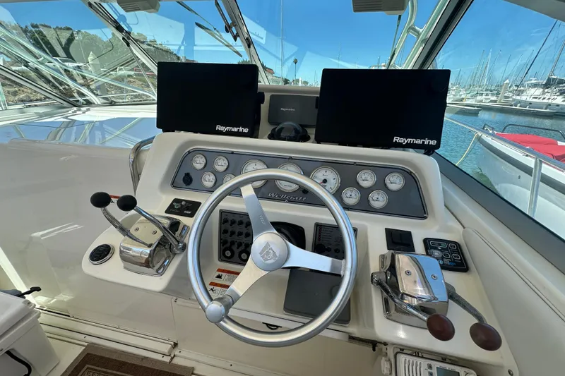 Slide: The Image of Helm of 2003 Wellcraft 330 Coastal boat with Raymarine navigation displays. - 10