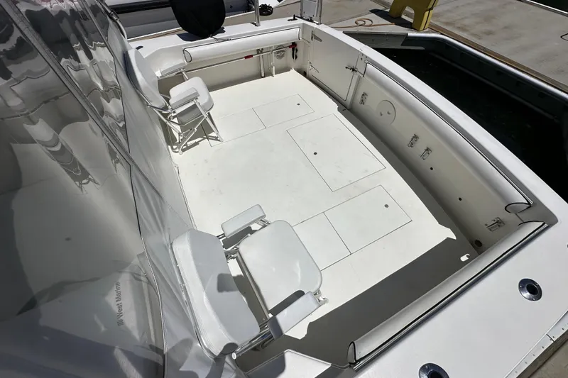 Slide: The Image of 2003 Wellcraft 330 Coastal boat deck with seating and storage compartments. - 6