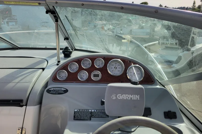 Slide: The Image of 2007 Bayliner 245 Cruiser dashboard with Garmin GPS and gauges. - 12