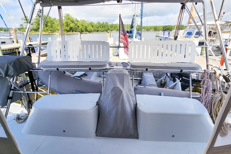 Slide: The Image of 2007 Antares Catamarans PDQ 44i cockpit with seating, docked at marina. - 14