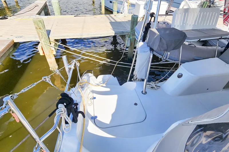 Slide: The Image of 2007 Antares Catamarans PDQ 44i docked, showing deck and mooring lines. - 15