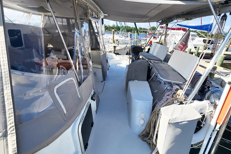 Slide: The Image of 2007 Antares Catamarans PDQ 44i cockpit with seating and covered helm station. - 18